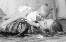 Shawna Stayce plays with her infant daughter, Cheyenne, in the fall of 1996. Shawna was one of 12 teenagers profiled in the News-Leader's "Class of 2000" project. Photo: Mike Wingo/News-Leader. 
