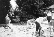 Community Beautification: Volunteers from the Community Beautification and Morale Team plant the garden at Front and Clinton Streets, a formerly blighted city gateway. Photo courtesy Debra Hogan