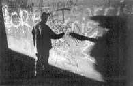A young graffiti artist decorates the walls of the "Acid Tunnel," a storm-water conduit in northeast Springfield where teenagers hang out. The 18-year-old, who calls himself "Sin," was one of the dozens of teens captured by reporters and photographers in the News-Leader's 3-7 special section in October 1995. Photo: Bob Linder/News-Leader. 