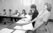 The work isn't all serious... Facilitator Joan Bandurchin breaks for a lighter moment during the Tourism Team's meeting at Lourdes Hospital. Copyright 1996 Binghamton Press & Sun-Bulletin. Photographer: Julia Schmalz